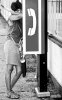 girl at the phonebooth, Chaguanas, 1997.jpg